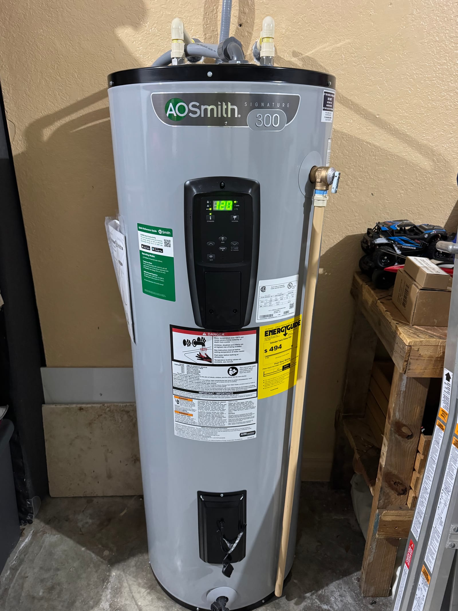 Brand-new A.O. Smith 300-series electric water heater staged for installation